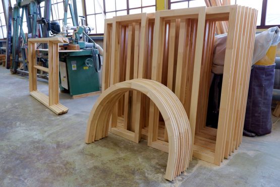 Rectangular and arched glued parts of wooden pine windows
